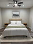 Bedroom #2 with queen bed and ceiling fan.