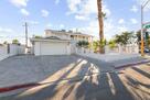 View of front facade with concrete driveway,