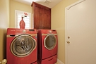 Separate laundry room with high-end washer an
