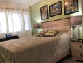 Bedroom with a desk and street view