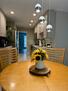 Dining table with pendant light fixture.