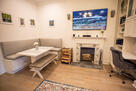 Banquette seating, fireplace, office corner