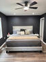 Primary bedroom with king bed and ceiling fan