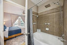 Spa tub with shower safety rails