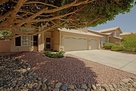 Impeccable landscaping of rock beds, flowerin