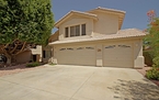 Stucco and Spanish tile architecture with thr