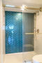 Walk-in shower with herringbone tile