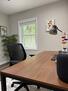Dedicated work space with ceiling fan.