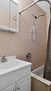 Full bathroom with bathtub, shower, and vanit