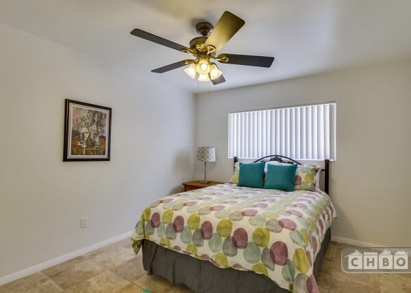 large bedroom with fans