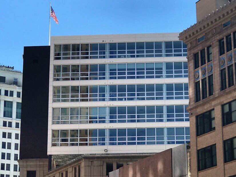 first set of windows on the second row.