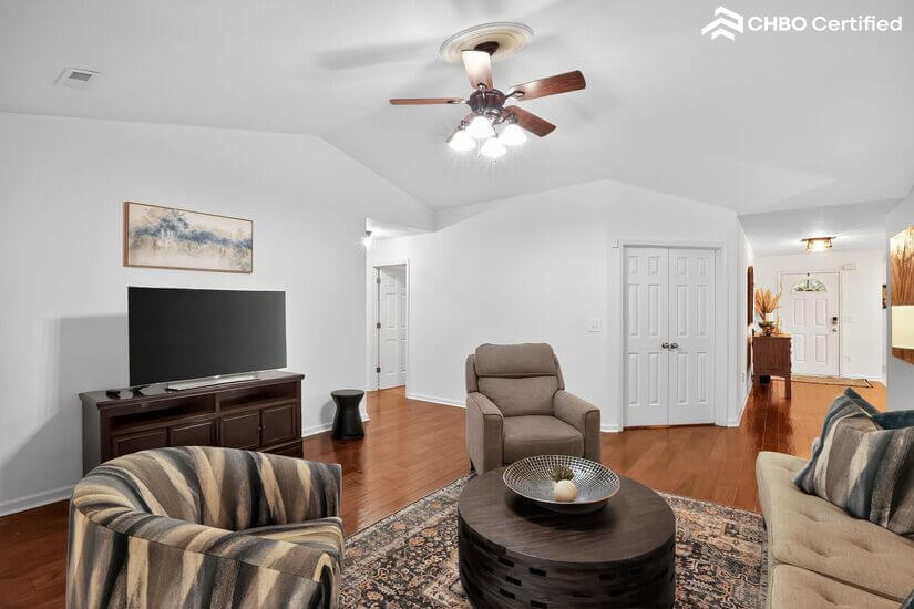 Spacious Living Room with Smart TV and Natural Light