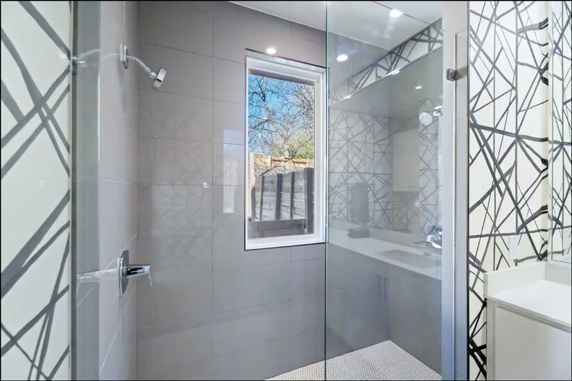 The primary ensuite includes a glass shower
