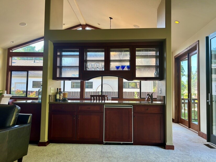 Bar separates living from dining room.