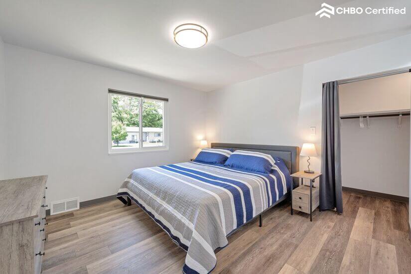 Master bedroom with king bed and large walk -in closet