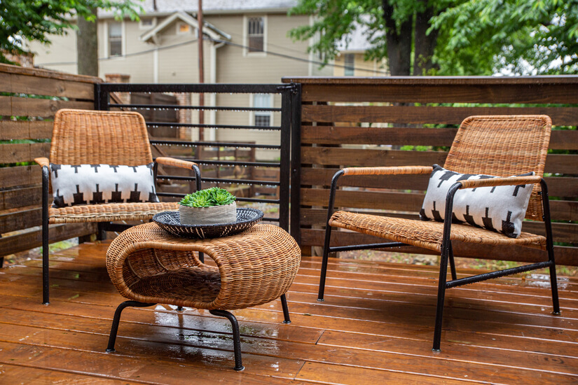 Outdoor lounge with stylish chairs and wood
