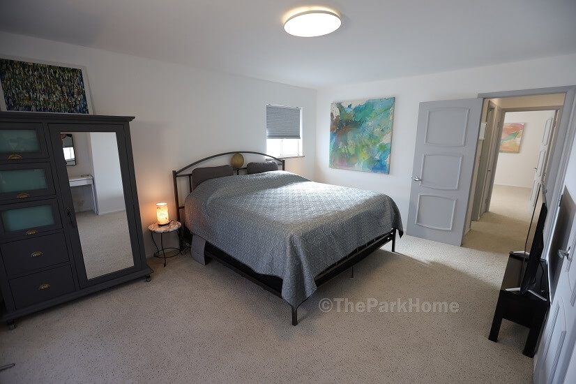 Primary suite with king bed, premium mattress, plus 50” TV
