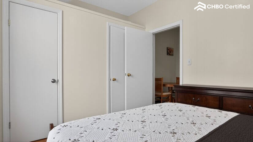 Bedroom with full-size bed and double-door closet
