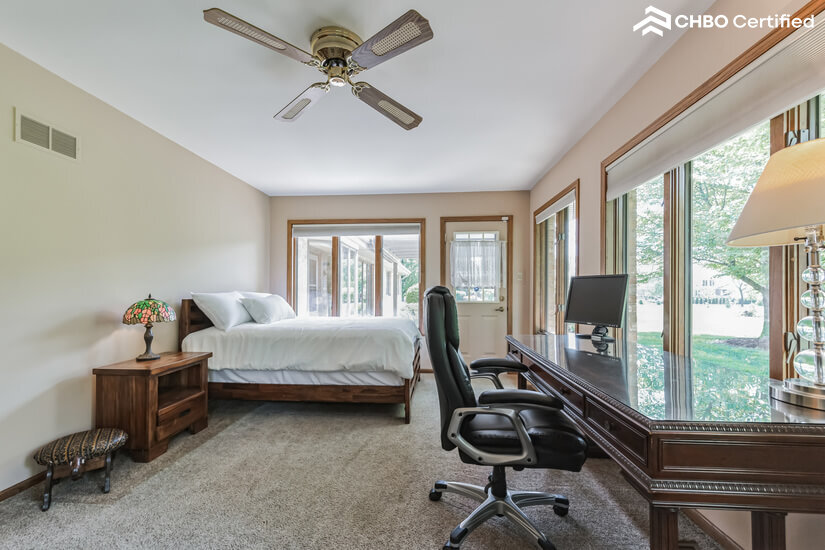 Bedroom 4 - windows on 3/4 walls, executive desk