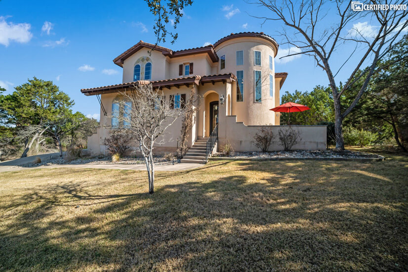 Spanish Stucco style exterior with views of TX Hill Country