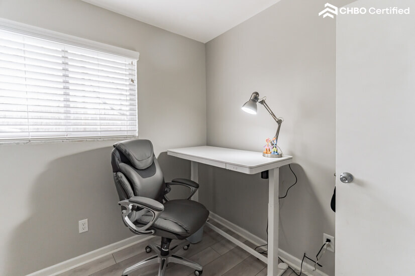 Height adjustable electric desk in office.