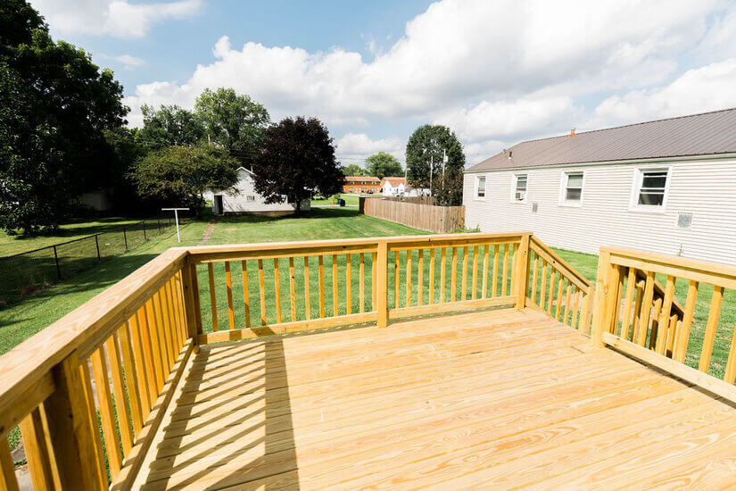 Deck view of backyard and Garage
