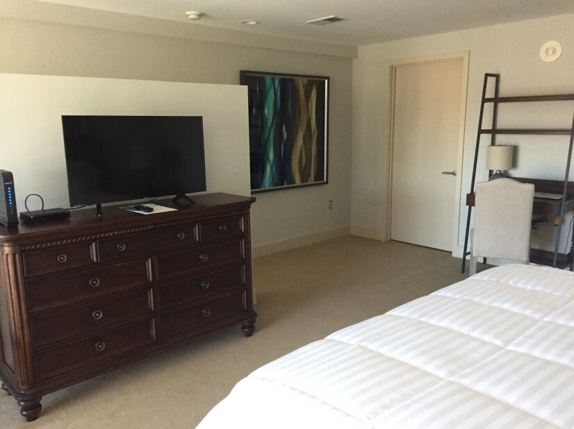 Large dresser with flat screen TV, walk in cl