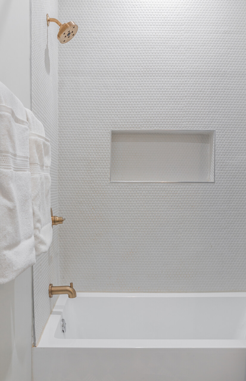 Spa-style bath with rainfall shower and tile