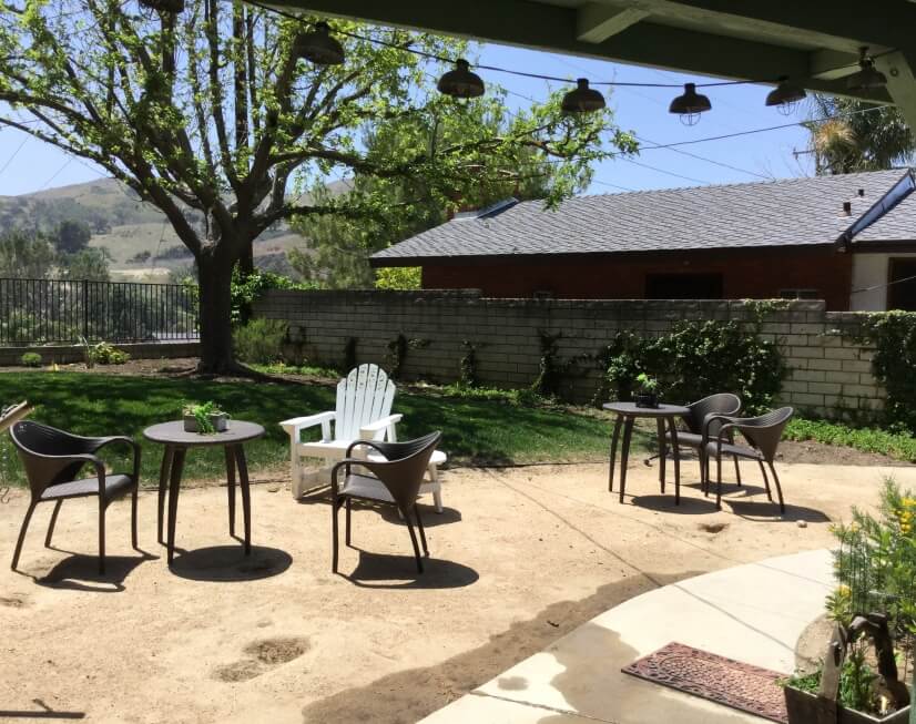 Lovely furnished and landscaped back yard is