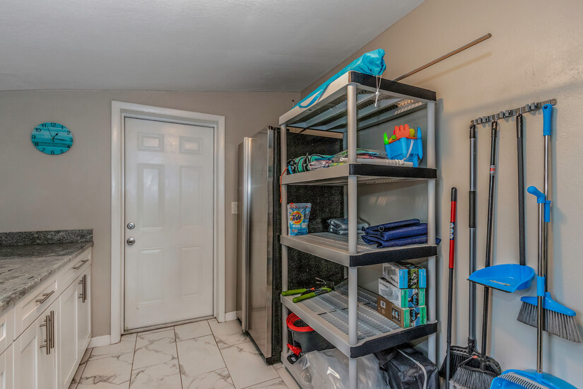 laundry room storage and service door to pool