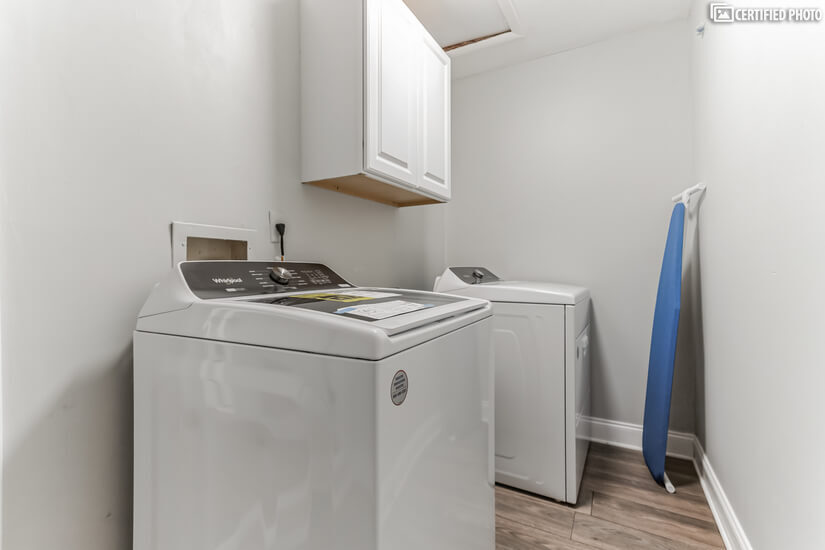 Laundry room with brand new washer and dryer