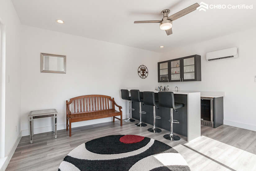 Wet bar along with bar stools for hosting