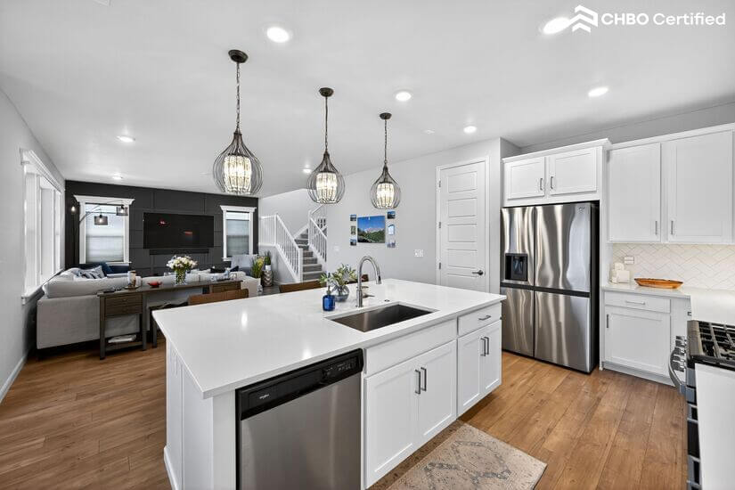Modern kitchen with quartz countertop  overlooks great room
