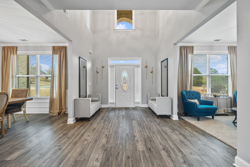 Walk in to see a 2-story foyer.