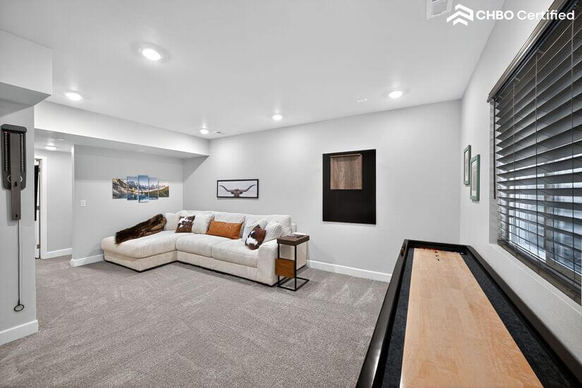 Basement includes TV, shuffleboard, dartboard, & ring game