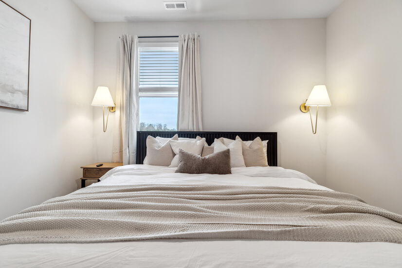 Refined Asho Bed with minimalist art and cozy accents