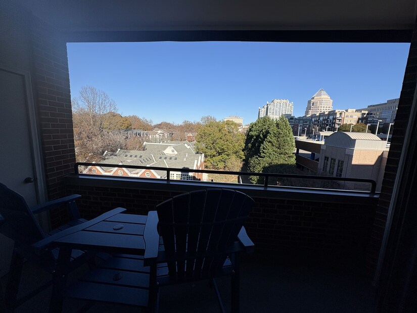 Covered balcony with city views