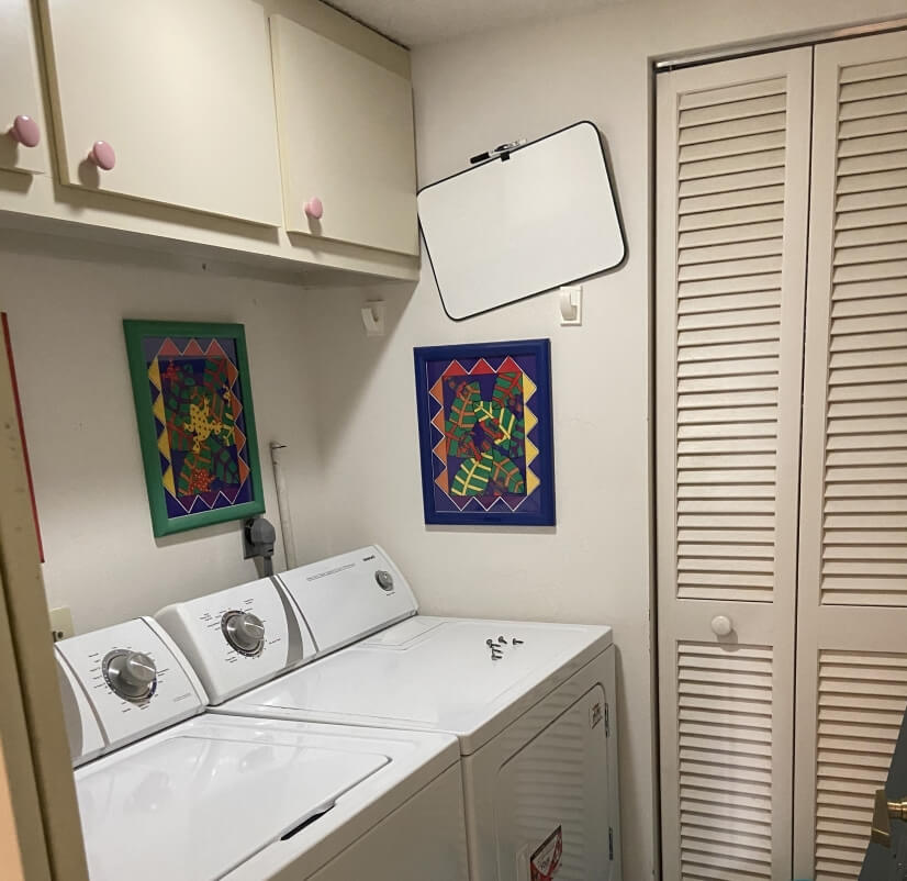 Complete laundry room with linen closet.
