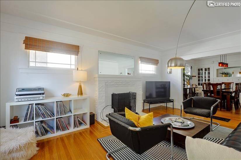 Living Room, complete with smart TV and record player.