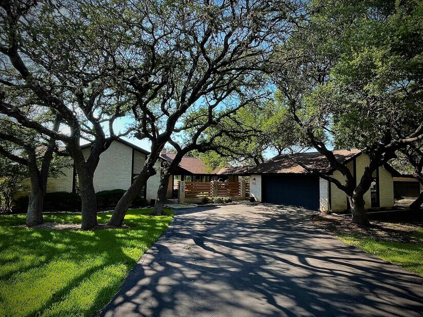 Front of House under a canopy of Live Oak Trees