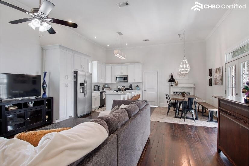 Open area with large sectional, 50 inch TV an