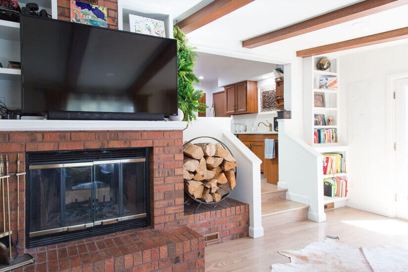 Living room with fireplace and TV