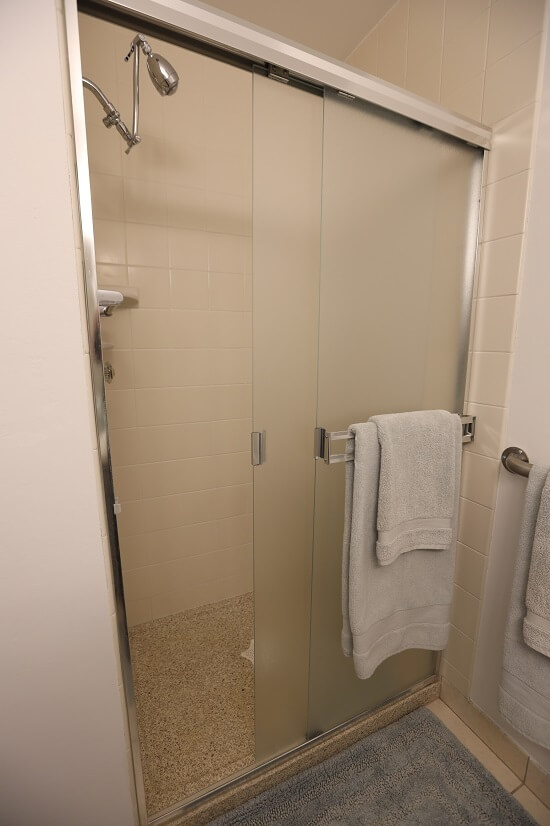 Walk-in shower in the en suite primary bath.