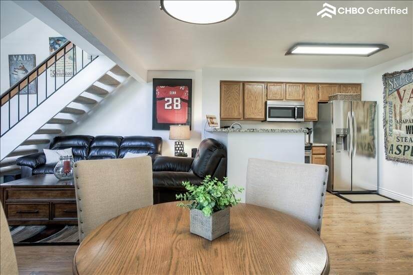 Dining table with Kitchen on left and living