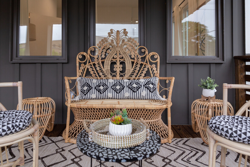 Cozy covered patio w/ elegant wicker seating
