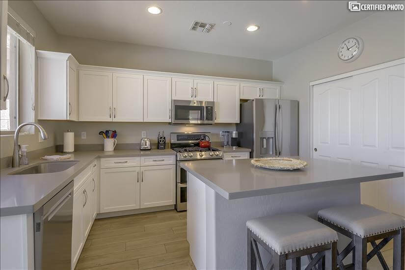 Kitchen w/stainless appliances & natural gas stove