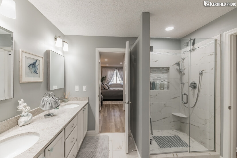 Master bathroom with bathtub, shower and double vanity