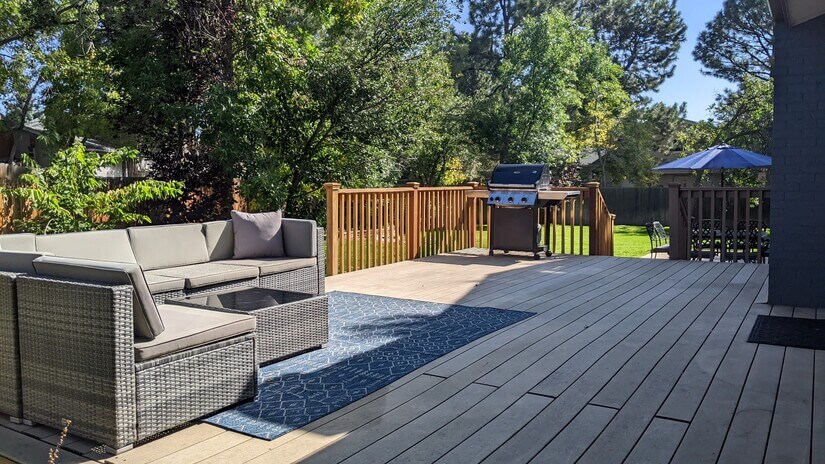 Large outdoor living space with gas grill