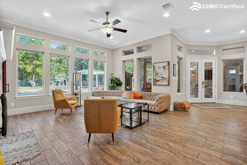 Sunlit living room with backyard views
