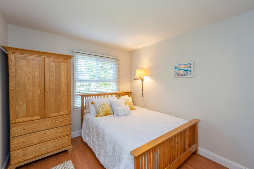 Bedroom 2 is bright and sunny with a sunshine linen motif.